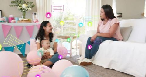 Newborn baby shower celebration with friends sharing smiles, pastel balloons and bunting