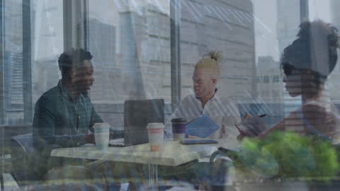 Team Collaborating in Tech-Driven Office Environment