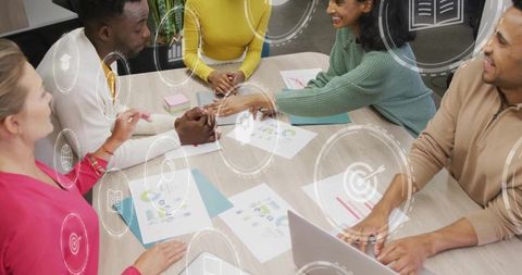 Diverse Business Team Collaborating and Analyzing Data