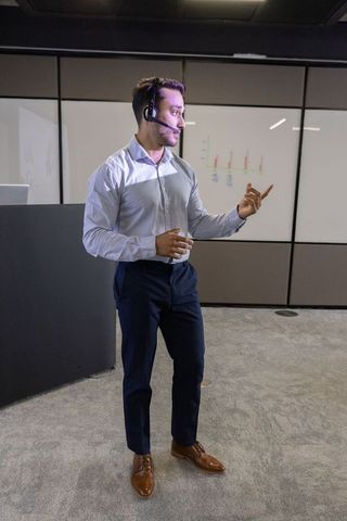 Professional Presentation: Asian Businessman with Headset and Data Charts