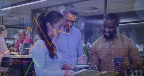 Team of Professionals Analyzing Documents in Open Plan Office