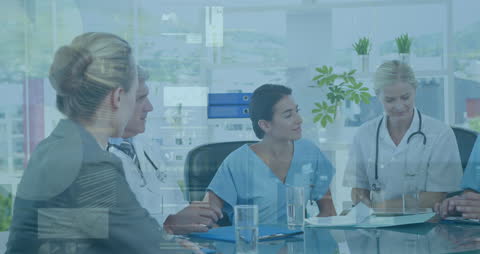 Health Professionals Collaborating with Financial Analytics Overlay