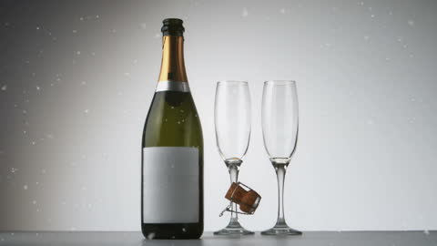 Champagne Celebration with Falling Cork and Snowflakes