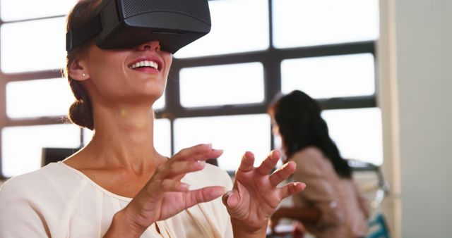 Woman using virtual reality headset at office 4k