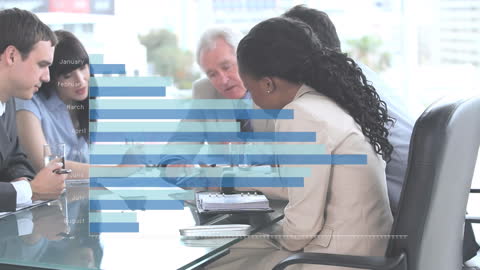 Diverse Business Team Analyzing Statistical Data in Office Meeting