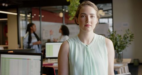 Confident Young Businesswoman in Modern Office Setting