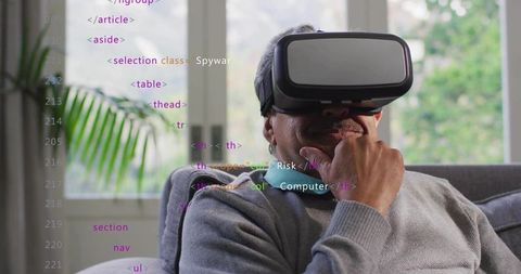 Senior man wearing vr headset, resting chin, contemplating virtual reality at home