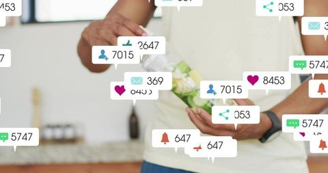 Pouring cucumber-infused water with floating social media alerts for modern wellness living