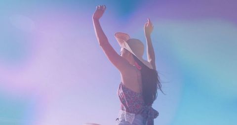 Carefree Woman in Straw Hat Enjoying Sunlight