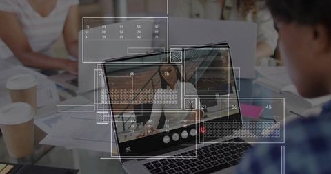 Hybrid Team Collaborating on Video Call with Laptop Data Overlays in Modern Office
