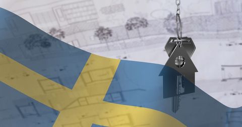 House key and swedish flag over architectural plans: real estate concept