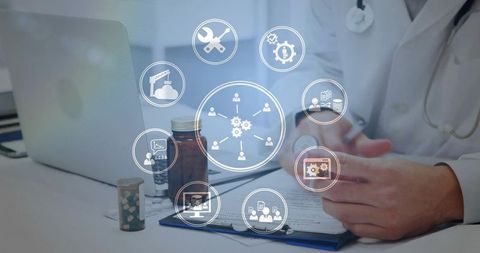 Doctor reviewing health records on tablet with medication bottles, laptop, telehealth icons