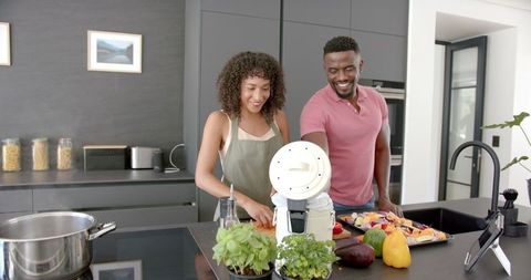 Couple Preparing a Healthy Meal in Modern Kitchen