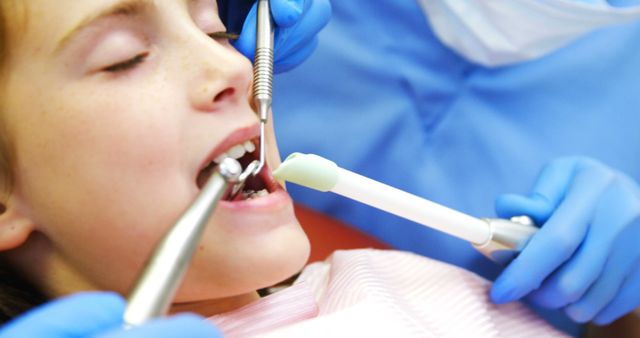 Child Receiving Dental Treatment from Professional Dentist in Clinic - Download Free Stock Images Pikwizard.com