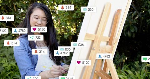 Young artist painting on outdoor easel with social media notification badges in garden