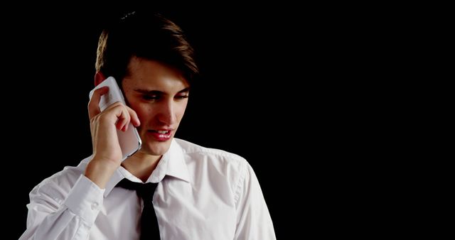 Young Professional Man Holding Smartphone, Talking, Looking Thoughtful - Download Free Stock Images Pikwizard.com
