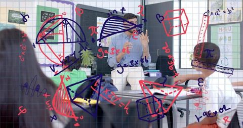 Male teacher demonstrating geometry with colorful diagrams and 3d shapes in bright classroom