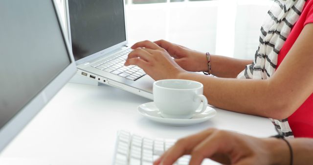 Business Professionals Typing on Laptops with Cup of Coffee in Bright Office - Download Free Stock Photos Pikwizard.com