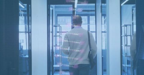 Businessman with Tech Overlays in Futuristic Office Entry