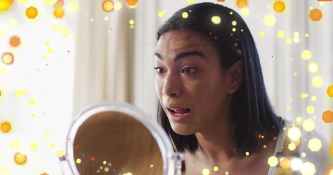 Biracial Woman Applying Makeup with Colorful Sparkles - Download Free Stock Images Pikwizard.com