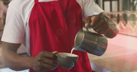 Barista Crafting Latte in Coffee Shop