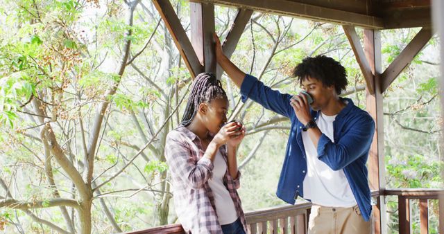 Young Couple Drinking Coffee on Porch in Spring - Download Free Stock Images Pikwizard.com