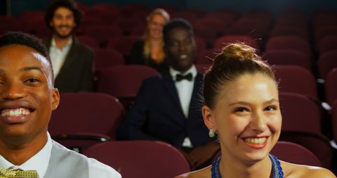 Enthusiastic Audience Awaiting Theater Performance