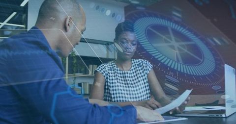 Business team reviewing documents with futuristic digital HUD overlay in modern office