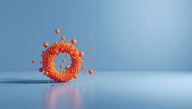 Floating orange torus of clustered spheres hovering over glossy pale-blue reflective floor