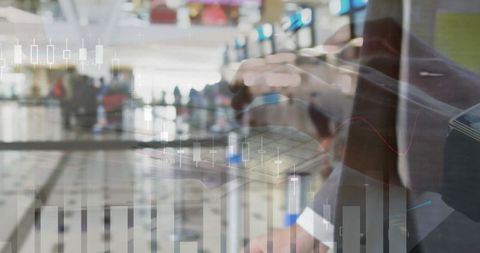 Businessman analyzing financial data at airport terminal