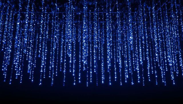 Hanging blue led curtain glowing vertical matrix of lights for stage exhibition and events