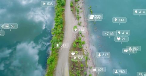 Revealing drone aerial of narrow sandbar and turquoise coastline with social media overlay