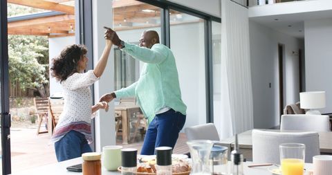 Joyful Couple Dancing in Modern Kitchen at Home - Download Free Stock Images Pikwizard.com