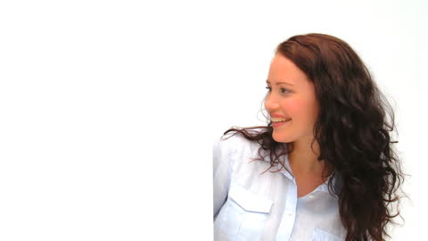 Brunette Woman Smiling in Bright Minimalist Space