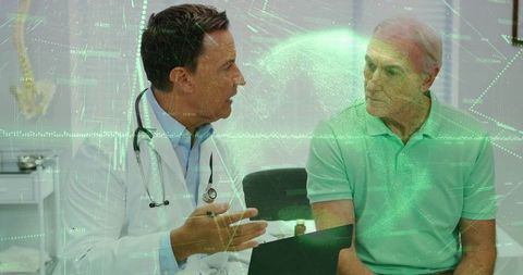 Doctor advising senior patient in modern clinic environment