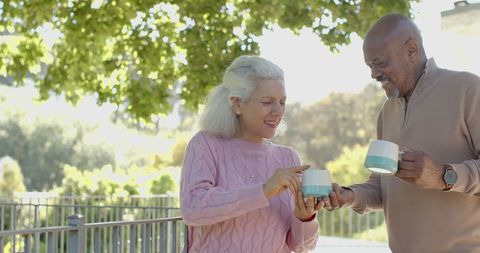 Senior Mixed Race Couple Enjoying Coffee Together Outdoors - Download Free Stock Images Pikwizard.com