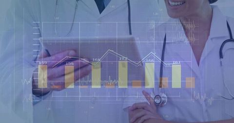 Doctors Analyzing Patient Data on Tablet With Digital Charts Overlay