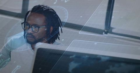 Analyzing data streams with hud overlays, black tech professional working at workstation