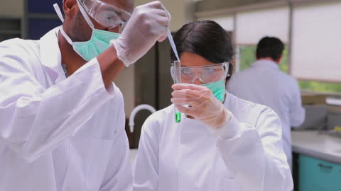 Scientists Conducting Experiments in Laboratory