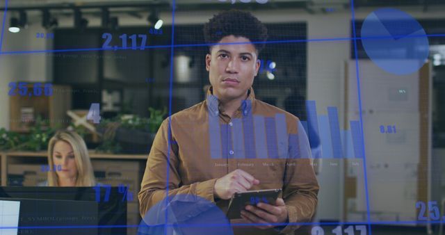 Young Professional Analyzing Data on Tablet with Holographic Charts - Download Free Stock Images Pikwizard.com