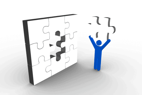 transparent blue man holding jigsaw piece near puzzle - Download Free Stock Videos Pikwizard.com