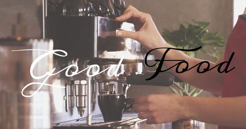 Barista making espresso at coffee machine in cafe