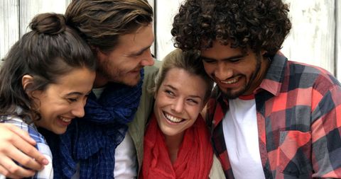 Diverse Friends Laughing Together Outdoors on a Sunny Day