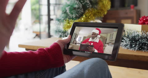 Festive Video Call with Person in Santa Hat During Christmas