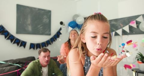 Birthday Party Celebration with Family and Confetti