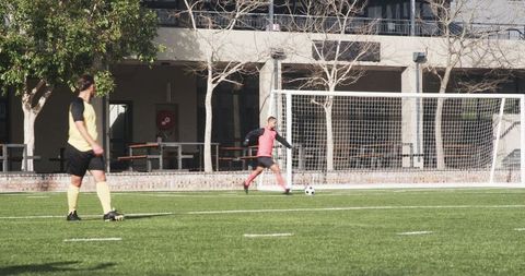 Soccer Players Displaying Dynamic Teamwork on Field