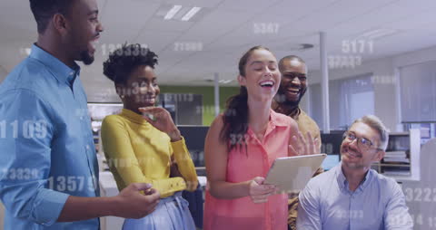 Diverse Business Team Analyzing Data Together in Office