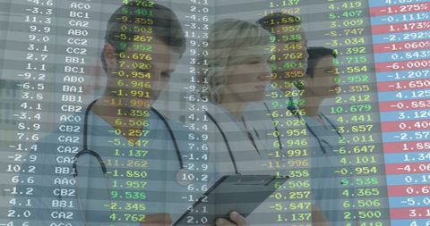 Healthcare Professionals Analyzing Data with Innovative Digital Displays