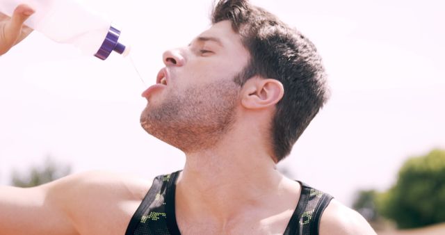 Young Athlete Drinking Water During Outdoor Exercise - Download Free Stock Images Pikwizard.com