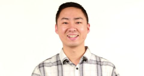 Cheerful Young Man Smiling with Copy Space on White Background